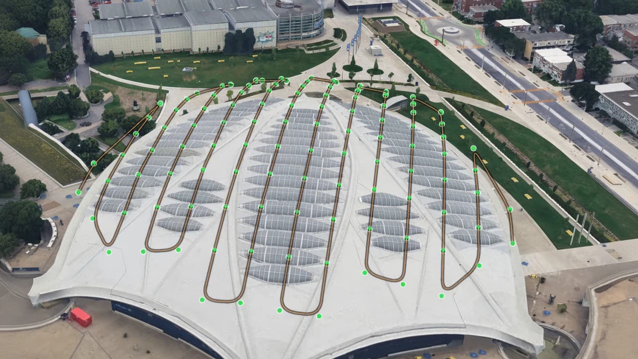Aerial exhibition-hall roof with a lawn-mower inspection path and waypoints over the skylights.